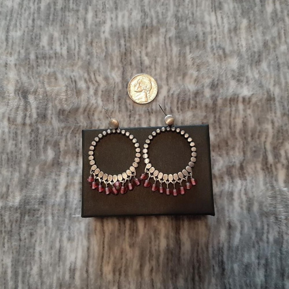 Silver tone pink dangle earrings